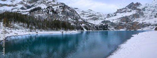 Oeschinen Lake with its iconic turquoise water in winter snow landscape