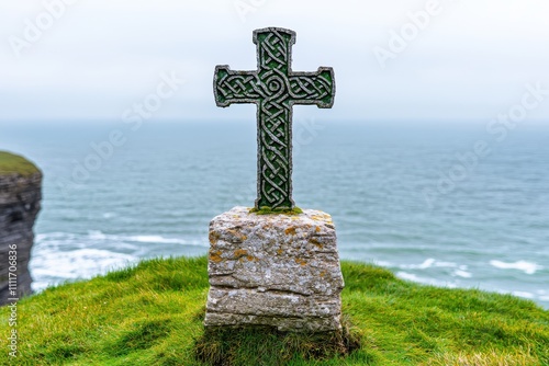 Stunning Coastal View Featuring an Ancient Celtic Cross Against a Serene Seascape photo