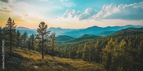 Scenic view of a picturesque landscape featuring trees across a stunning mountain range beneath a vast sky, showcasing the beauty of nature in this captivating landscape setting.