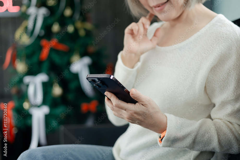 Woman wearing headphones and using a smartphone Woman wearing headphones and using a smartphone