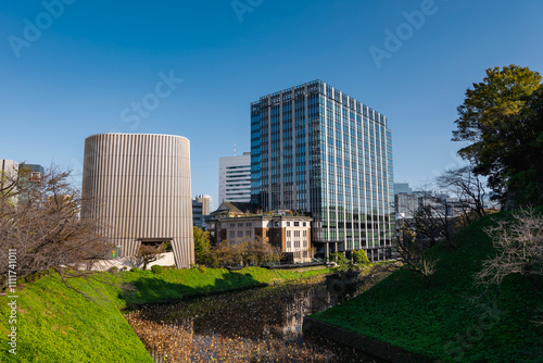 Modernist Showa Hall and Historic Kudan Kaikan Hall Amid Lush Greenery (Tokyo, Japan ‐ November 2024) photo