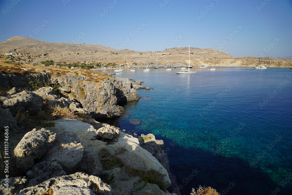 rocky cliffs of Lindos , coastline around the Acropolis rocky cliffs of Lindos , coastline around the Acropolis