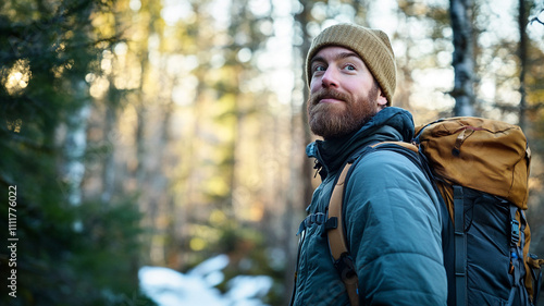 Man hiking through forest trails during early morning light in a serene natural setting