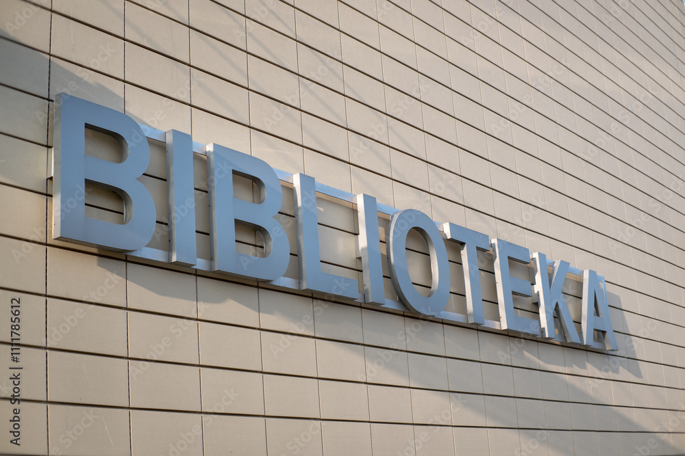 An inscription on the building in Polish, library.
An inscription on the building in Polish, library.