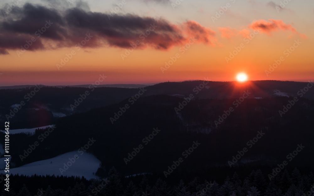 Fototapeta premium Colorful sunset over the Czech countryside. View of the Krkonoše mountains from the Teplice-Adršpašská rocks.
