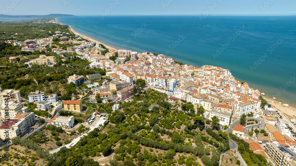 Fototapeta premium Aerial view of the town and the historic center of Rodi Garganico, located in Puglia, Italy, on the coast of the Adriatic Sea. It is a tourist destination in Gargano, in the province of Foggia.
