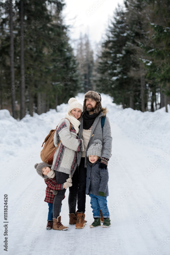 Portrait of family standing in the middle of winter snowy nature. Portrait of family standing in the middle of winter snowy nature.
