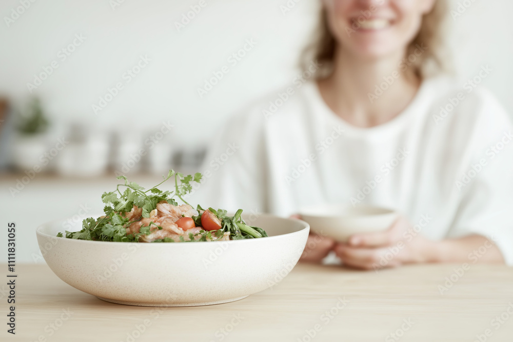 woman eating salad