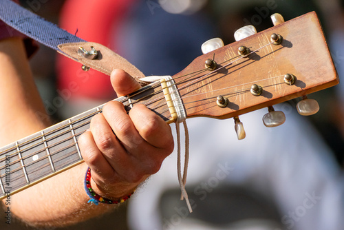 musician's hand expertly navigating the fretboard of a guitar