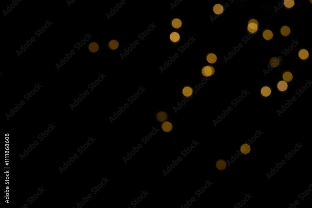 Golden blurred bokeh lights on black background. Glitter sparkle stars for celebrate. Overlay for your design Golden blurred bokeh lights on black background. Glitter sparkle stars for celebrate. Overlay for your design
