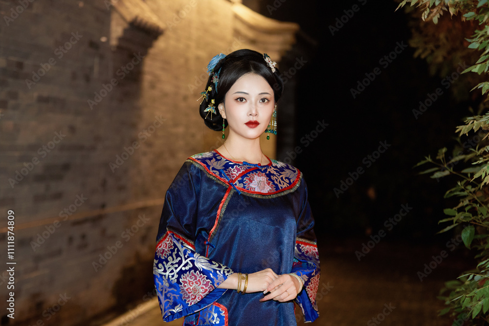 Beautiful women wearing Chinese late Qing Dynasty costumes strolling in the ancient city in the evening Beautiful women wearing Chinese late Qing Dynasty costumes strolling in the ancient city in the evening