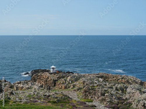 Lighthouse - small white lighthouse Kullaberg in Sweden. Kullaberg small white lighthouse on the Kullaberg rocky coast in Sweden photo