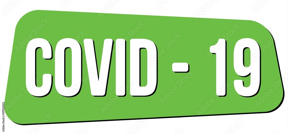 COVID - 19 text on green trapeze stamp sign. COVID - 19 text on green trapeze stamp sign.