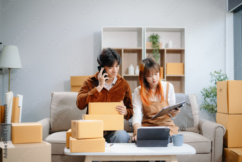 Asian man and woman working at home office, BOX, tablet and laptop online, marketing, packaging, delivery. Asian man and woman working at home office, BOX, tablet and laptop online, marketing, packaging, delivery.