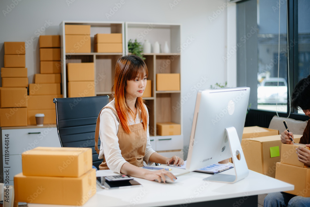 Asian man and woman working at home office, BOX, tablet and laptop online, marketing, packaging, delivery. Asian man and woman working at home office, BOX, tablet and laptop online, marketing, packaging, delivery.