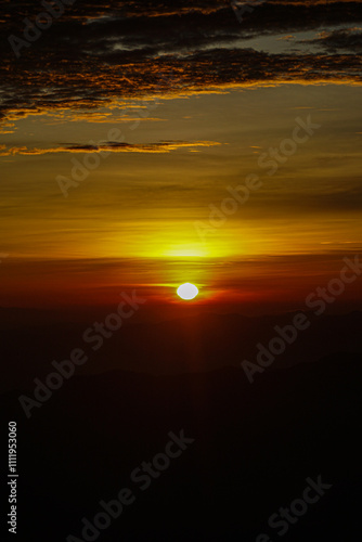 Sunset over mountains scenic view nature photography majestic environment captivating landscape tranquil atmosphere for relaxation photo