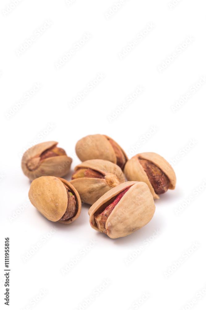 Pistachios nuts over white background. Healthy food concept. Pistachios nuts over white background. Healthy food concept.