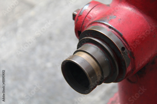 Cut out of A classic red fire hydrant stands tall on a city street. Perfect for urban, infrastructure, and emergency themes