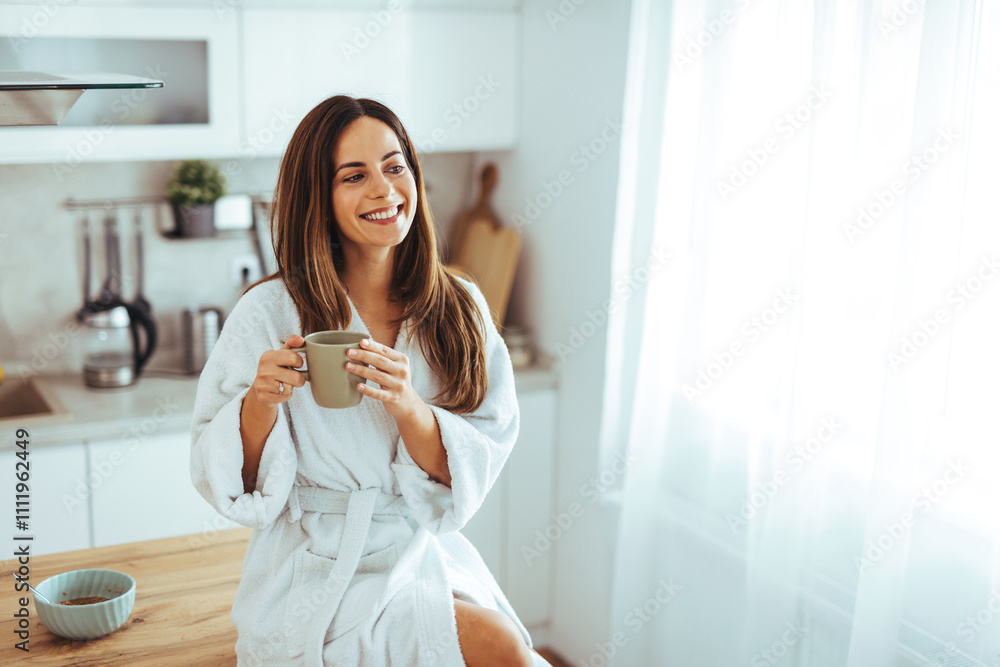 Smiling Woman Enjoying Morning Coffee in Bright Kitchen Smiling Woman Enjoying Morning Coffee in Bright Kitchen