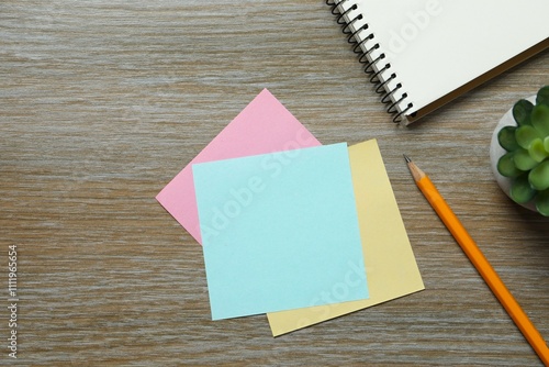 Workplace with notebook, pencil, paper notes, top view 
