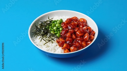 Colorful Bowl of Rice with Chicken, Seaweed, and Green Peas