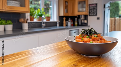 Fresh Salmon Salad Bowl with Green Peas and Seaweed in a Kitchen