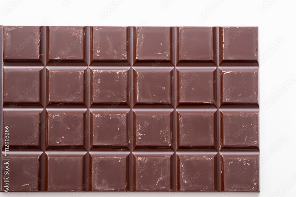 A close up of a chocolate bar on a white background. White chocolate bar with a white background. Chocolate bar white background brown. A white chocolate ganache with a lifestyle brown background. A close up of a chocolate bar on a white background. White chocolate bar with a white background. Chocolate bar white background brown. A white chocolate ganache with a lifestyle brown background.