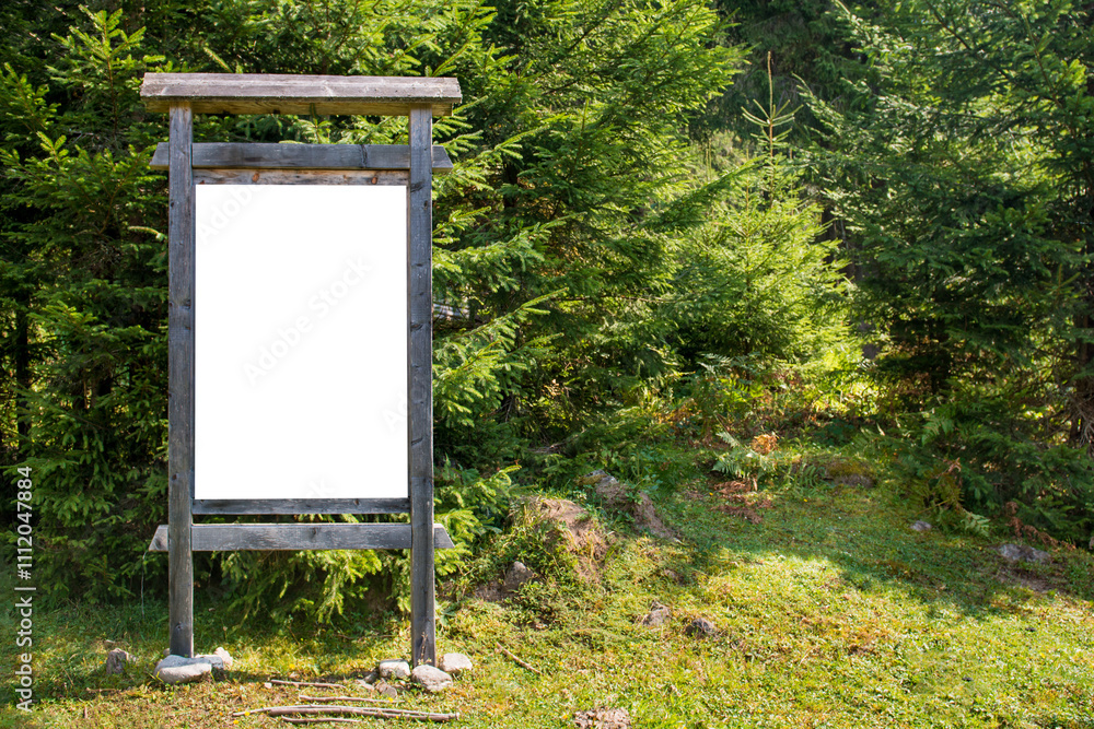 White blank wooden sign board in green forest isolated on white