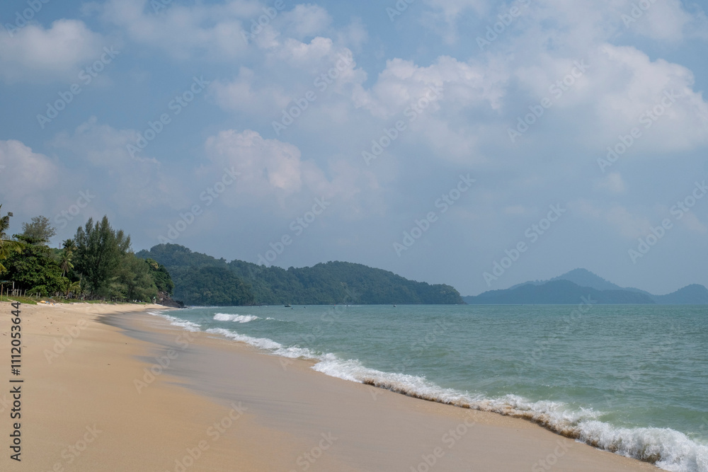 Langkawi Island Malaysia. Tourists on Pantai Cenang beach - one of the most popular white sand beaches Langkawi Island Malaysia. Tourists on Pantai Cenang beach - one of the most popular white sand beaches