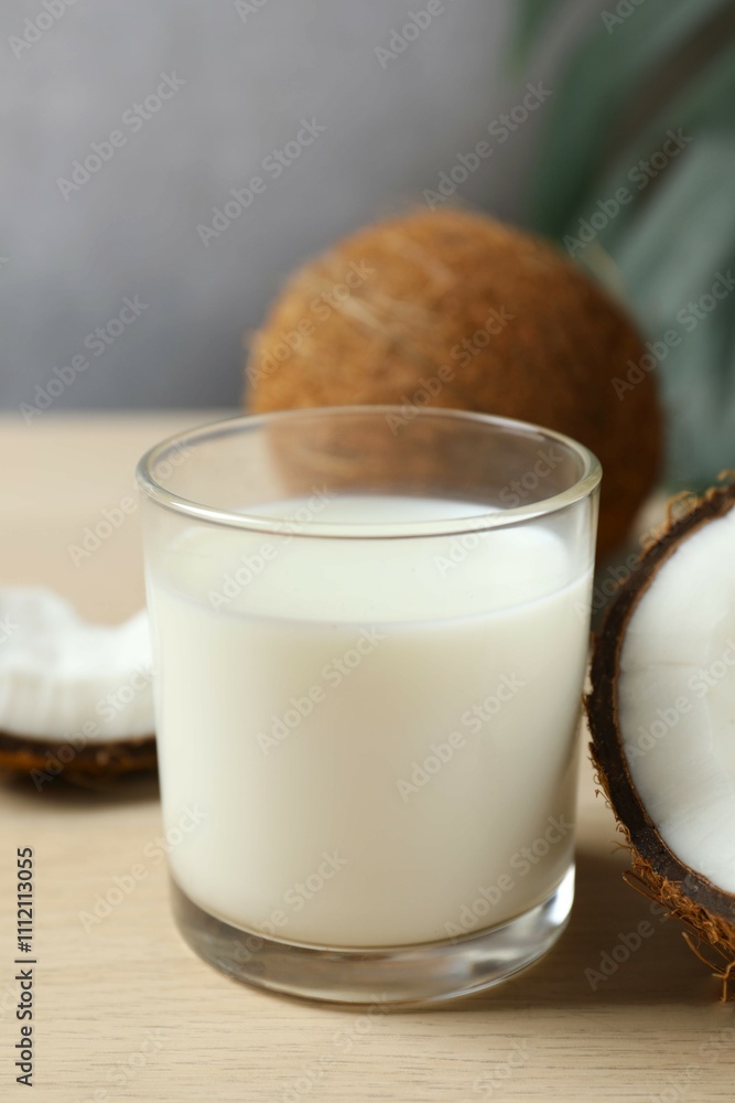 Glass of milk with coconuts on the table Glass of milk with coconuts on the table