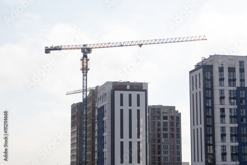 Daytime View of Construction Site with Active Crane