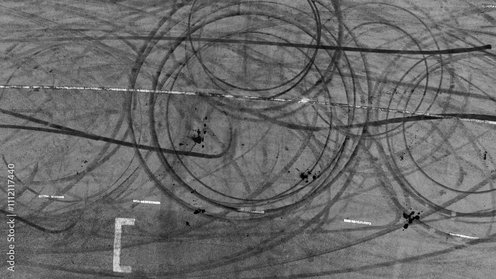 Tire mark from car skid mark, Car tire mark skid mark on asphalt road race track, Texture and background car wheel tire mark on asphalt road.