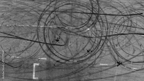 Obraz na płótnie Tire mark from car skid mark, Car tire mark skid mark on asphalt road race track, Texture and background car wheel tire mark on asphalt road. w salonie