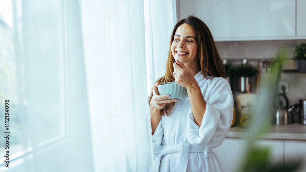 Woman Enjoying Breakfast With a Smile in the Morning Light Woman Enjoying Breakfast With a Smile in the Morning Light