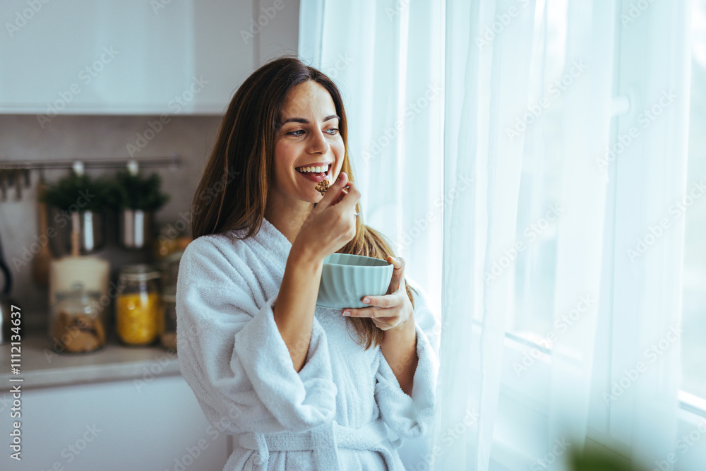 Happy Woman Enjoying Breakfast in a Sunlit Modern Kitchen Setting Happy Woman Enjoying Breakfast in a Sunlit Modern Kitchen Setting