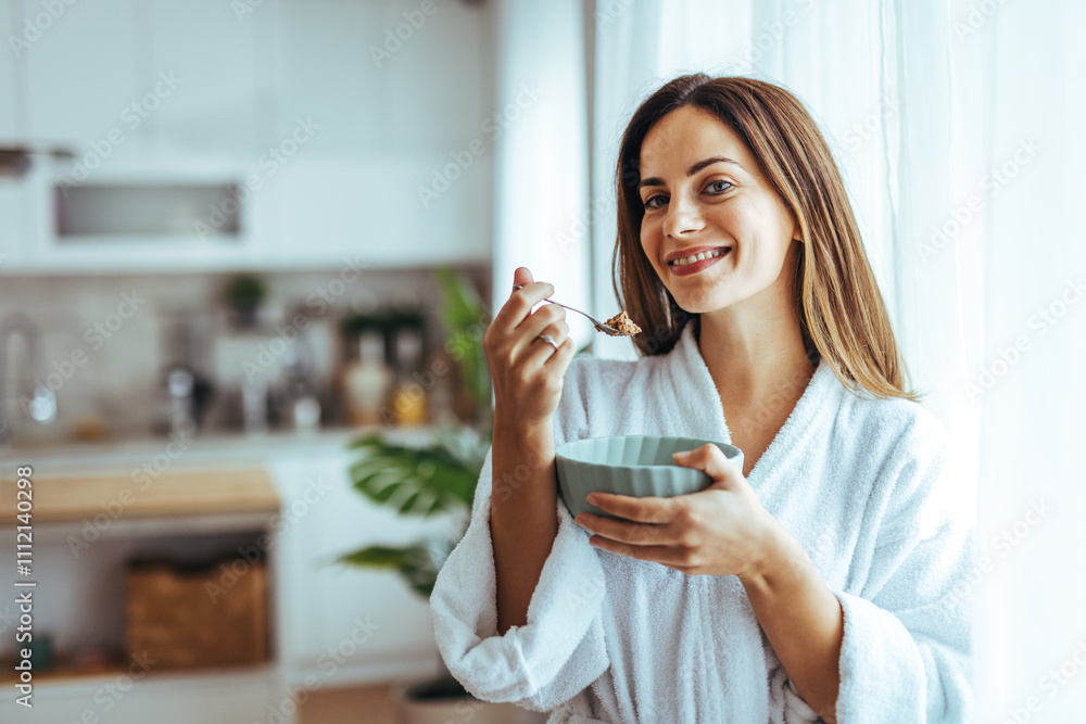 Woman Enjoying Breakfast In Cozy Kitchen With Bright Atmosphere Woman Enjoying Breakfast In Cozy Kitchen With Bright Atmosphere