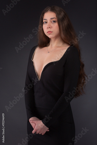 Fashion portrait of pretty woman in black dress