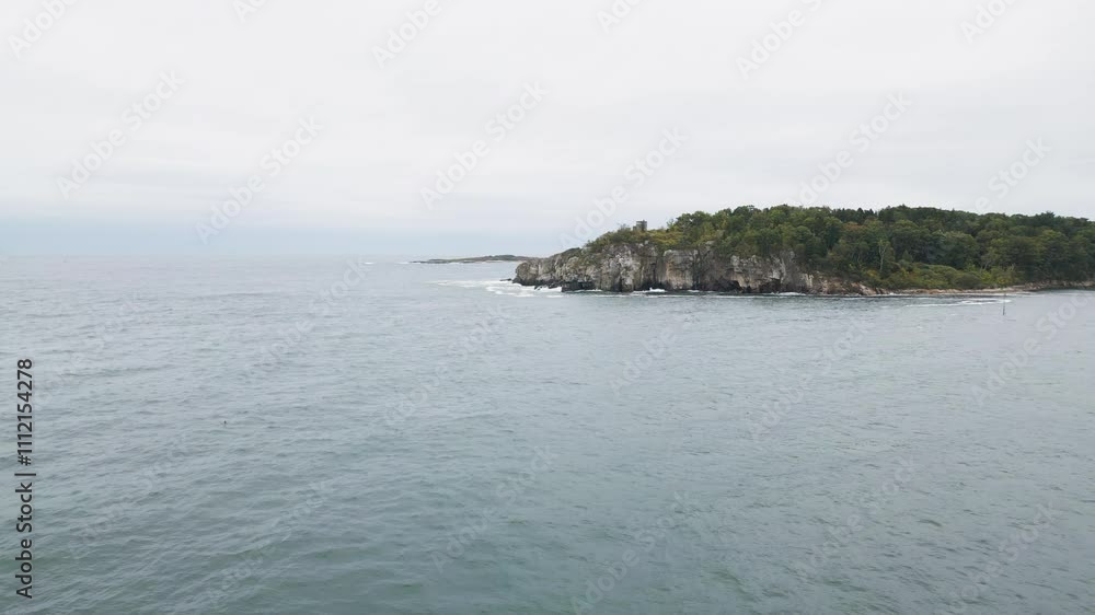 Aerial view over the water of Casco Bay with views of Cushing Island and White Head Point. Aerial view over the water of Casco Bay with views of Cushing Island and White Head Point.