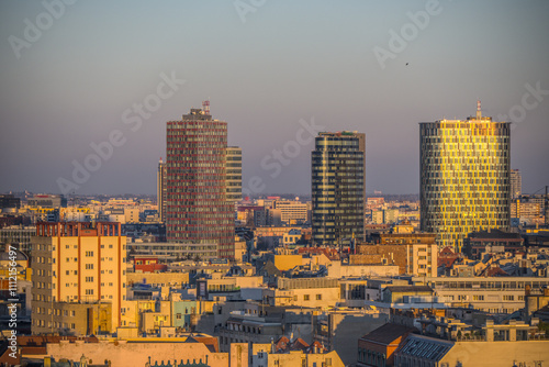 Photography Skyline of Bratislava with modern high-rise buildings lit by golden hour sunlight