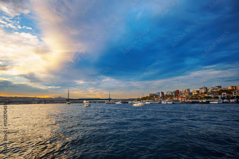cityscape of Istanbul, Turkey, view to the Golden Horn Bay and architecture of city and ships and Bosphorus shore against the sunset sky, a popular tourist destination cityscape of Istanbul, Turkey, view to the Golden Horn Bay and architecture of city and ships and Bosphorus shore against the sunset sky, a popular tourist destination