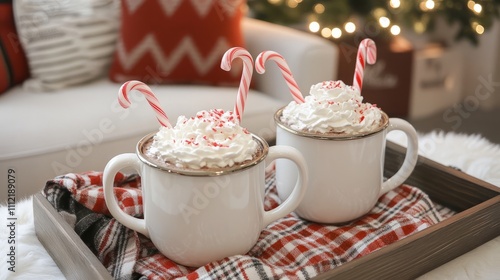 A frosted white cake with red berries and A festive tray with mugs of hot chocolate A cozy holiday table set with plates glasse