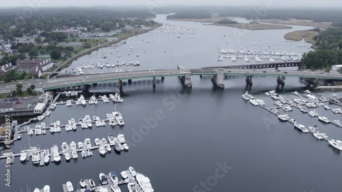 Foggy Aerial View of Newburyport Harbor and Bridge with Boats and Cars