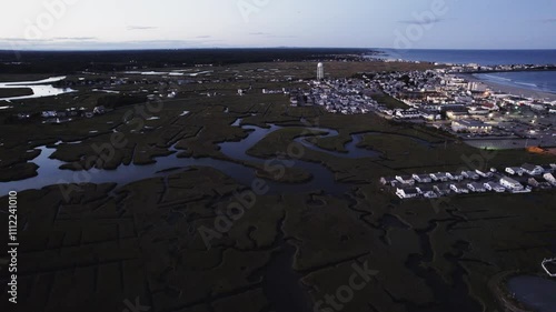 Evening Aerial Above Swamp and Water Channels Near Coastal Town