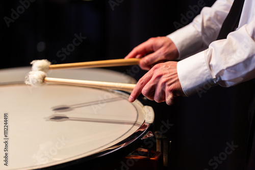 Timpani Drum being played in percussion section during concert