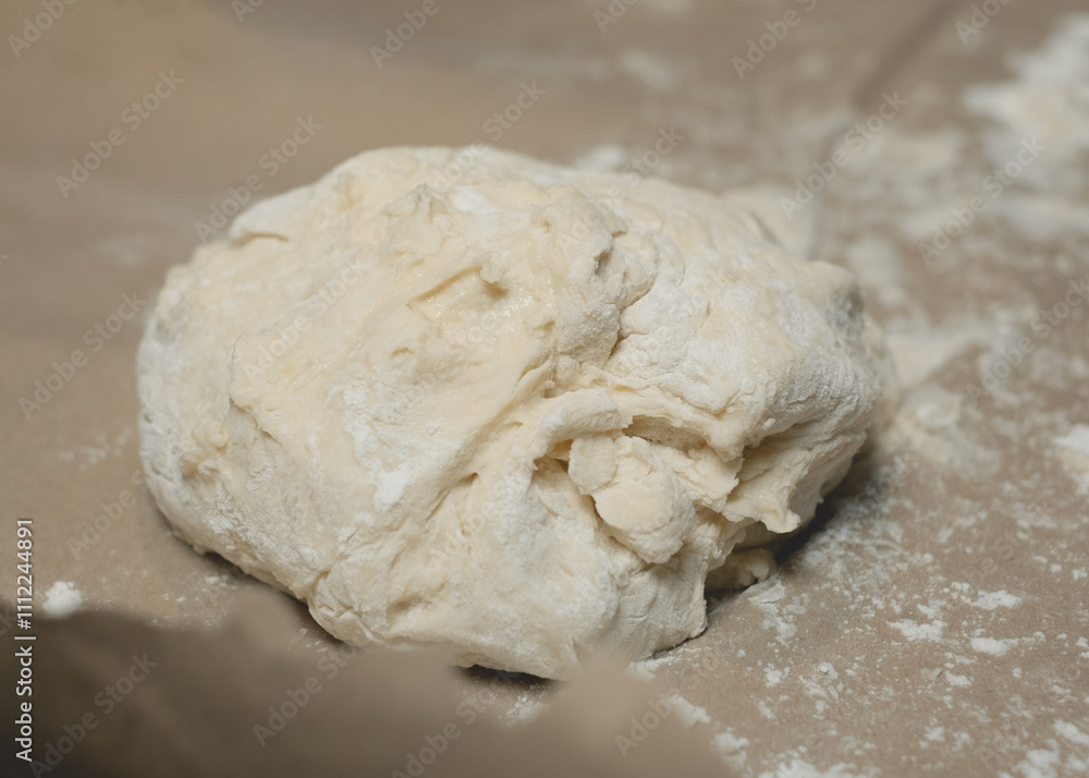 Soft dough on kitchen countertop. Soft dough on kitchen countertop.