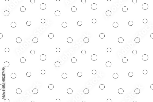 Abstract pattern of randomly scattered circles in black and white, ideal for creative or educational coloring.