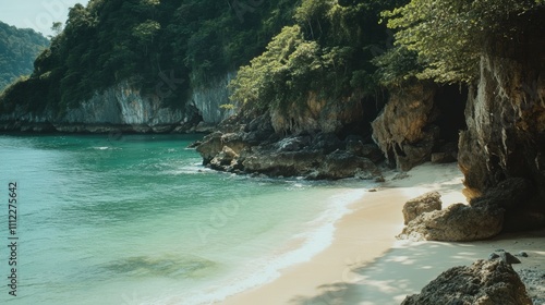 Serene Tropical Beach With Calm Water, Lush Green Cliffs, and Rocky Outcrops, Ideal for Relaxation and Nature Exploration in a Coastal Paradise