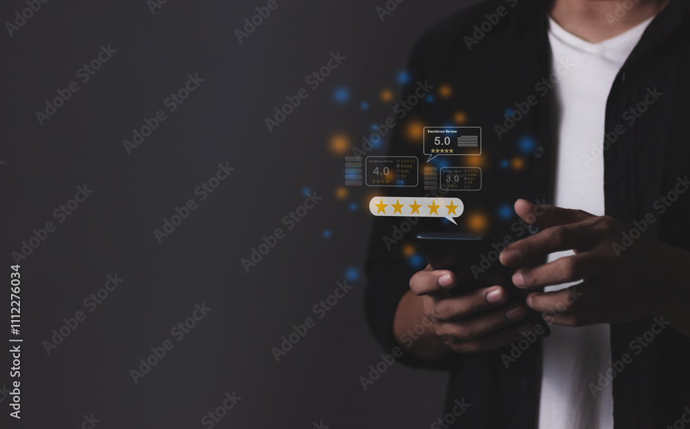Review Excellence, Young Man hand holding Smart Phone with five star to review and give 5 stars with very good results in service, Good review 5 star rating choice feedback Review Excellence, Young Man hand holding Smart Phone with five star to review and give 5 stars with very good results in service, Good review 5 star rating choice feedback