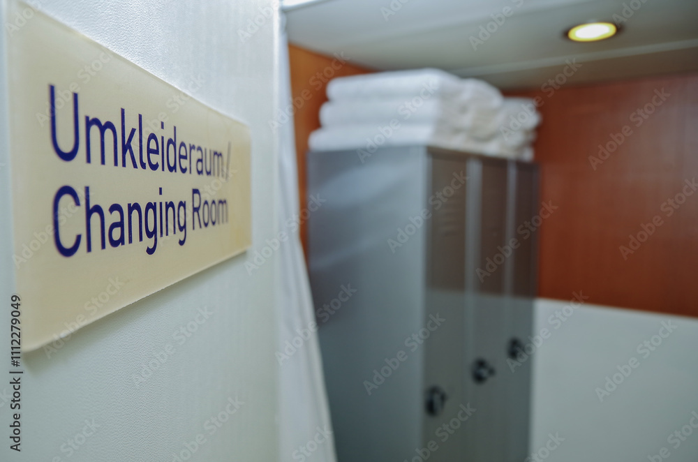 Male locker changing room with lockers, towel rack, sink and amenities inside spa thermal suite wellness area on classic cruiseship cruise ship liner Male locker changing room with lockers, towel rack, sink and amenities inside spa thermal suite wellness area on classic cruiseship cruise ship liner