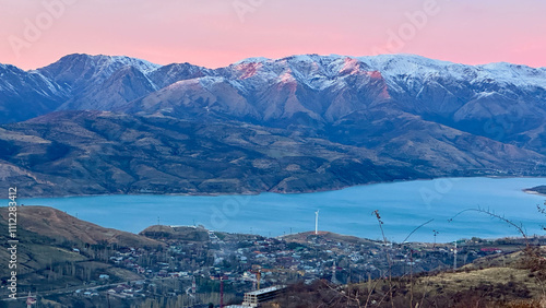 Snowy peaks mountains at the sunset